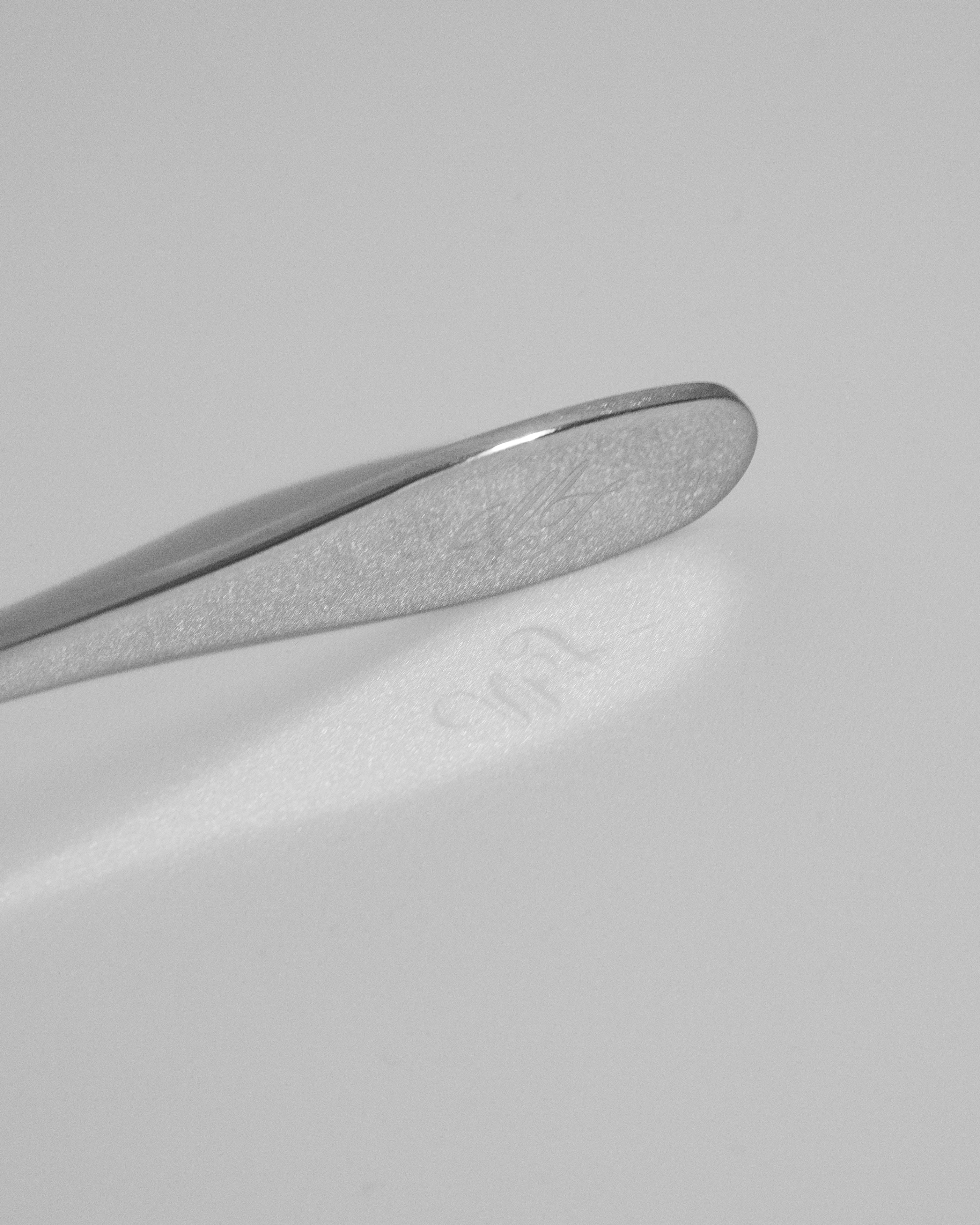 Close-up of a metallic object on a gray background